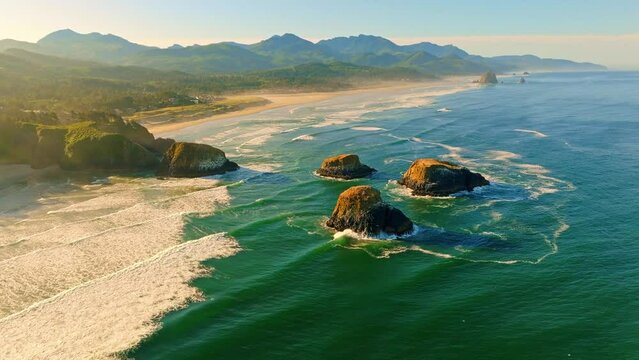 Aerial Sunrise Flight Over Iconic Bird Rocks and hover in front of Canon Beach