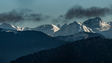 Peaks under dusk clouds