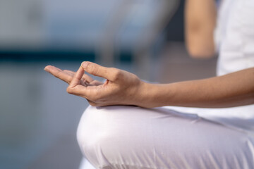 Closeup of a woman practicing yoga.