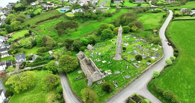 Ireland Epic locations drone circling historic religious site of St Declan,Ardmore Round Tower and Cathedral with village of Ardmore Co.Waterford on a summer day