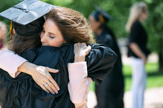 Grad: Parent And Child Share An Embrace