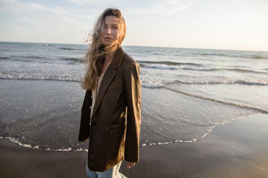 Wistful woman on the beach