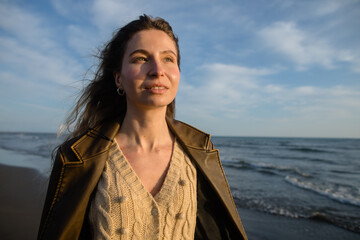 Inspired young woman on the beach