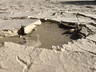 Dried and cracked mud at Mesquite Flat Sand Dunes in Death Valley