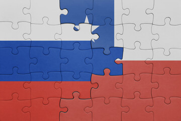 Fototapeta premium puzzle with the colourful national flag of chile and flag of russia.