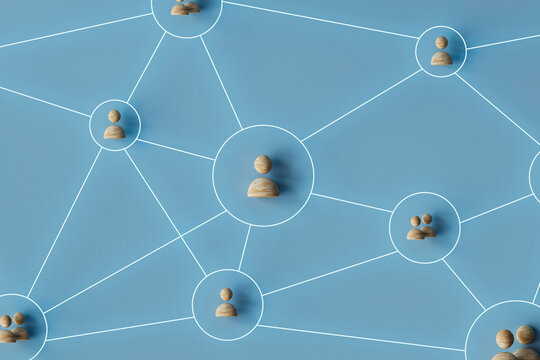 Wooden Figures on Blue Network Diagram