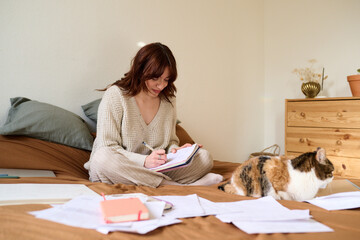 Work from home accompanied by her cat