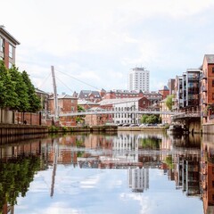 Urban landscape with skyscrapers, a bridge, and a waterfront