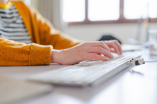 Professional Working at Bright Desk