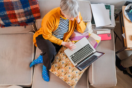 Senior Woman Working on Laptop at Home