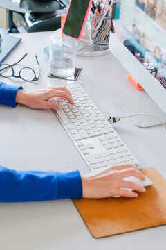 Office Worker Typing on Keyboard