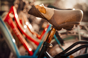Closeup of a broken damaged bicycle saddle.