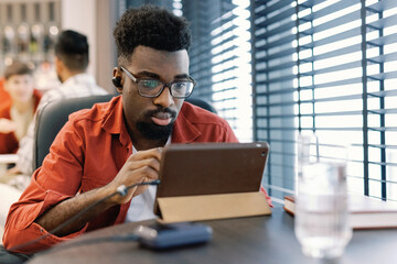 Busy male freelancer working on startup