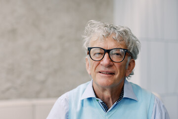 Portrait of Smiling Senior Man with Glasses
