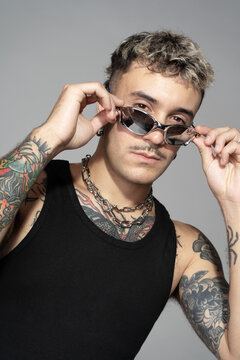 Trendy hairstyle, looks confidently