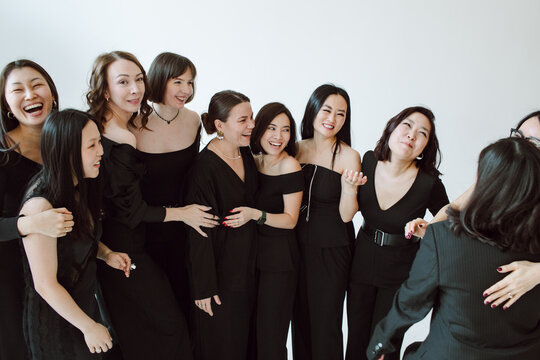 group of  10 women laughing