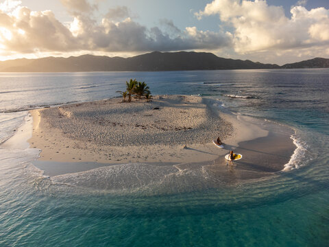 Woman Exploring Remote Caribbean Island with Stand Up Paddle Boa
