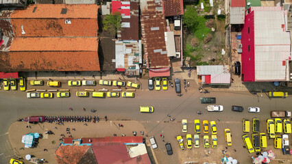 Seen from above a cluster of stopped taxis in the city of Sao Tome