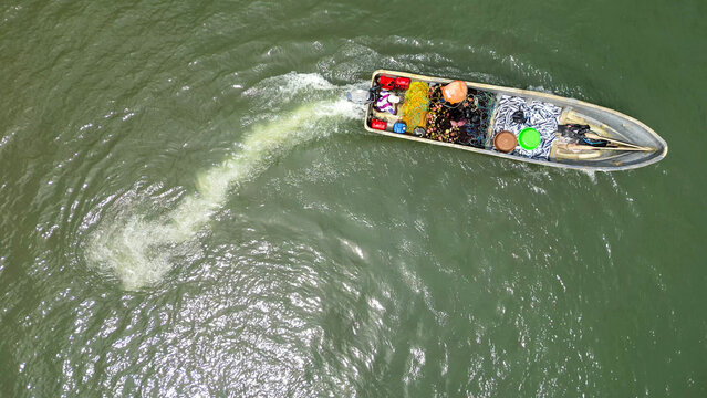 Aerial view of a African fishermen  with a boat full of  fish