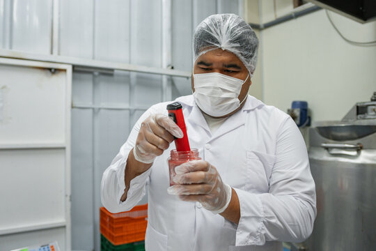 Food Industry Plus Size Worker Using Technology