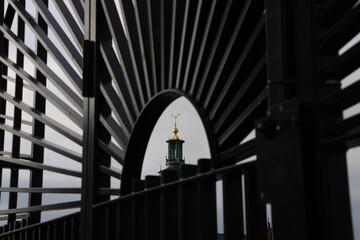 Artistic photo of Stockholm City Hall's tower. With an Swedish symbol.The three golden crowns on top