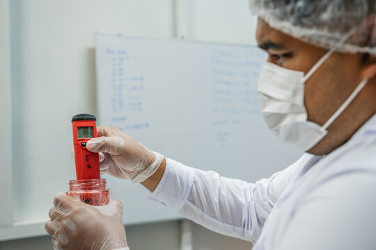 Scientist Measuring Ph at Laboratory