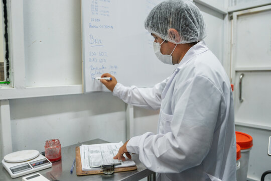 Scientist in Uniform writing on a Whiteboard