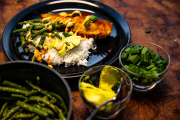 a dinner plate with fried chicken and veggies on the side