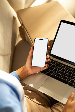 Mockup phone with white screen and Unboxing parcels and working laptop