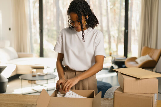 Woman Unboxing New Purchase at cozy home