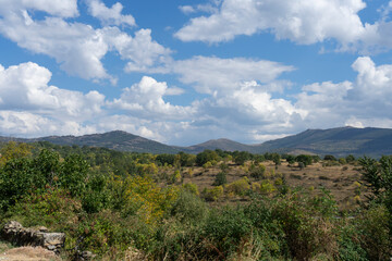 Typical Castilian inland landscape with mountains and flat areas under a bright sky