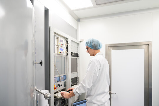 Scientist Using Electron Beam Evaporation System