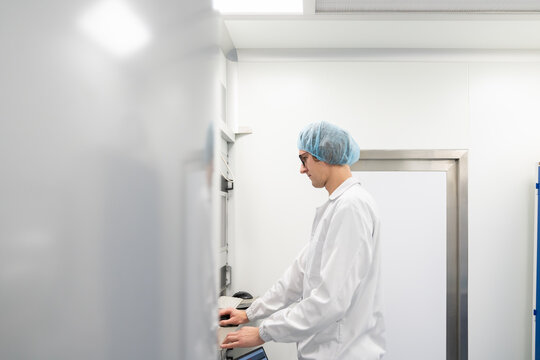 Scientist Working In Clean Room