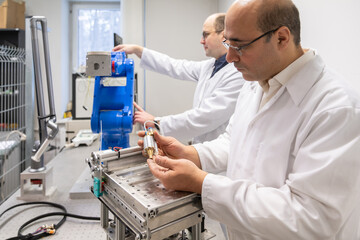 Scientists Working At Robotics Laboratory Room