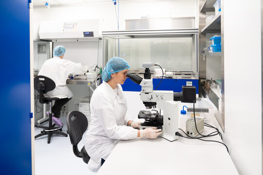 Scientists Working In Optical Coatings Laboratory