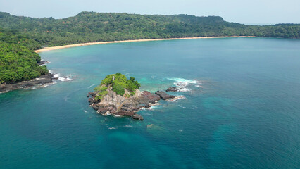 Turtle sanctuary beach with palm trees and a distant hill, Sao Tome and Principe, Africa