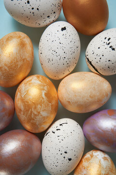 Various Easter eggs on bright blue background. 