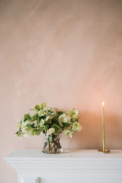 Minimalist floral arrangement on mantelpiece