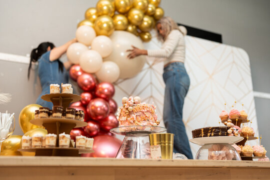 Setting up party decoration.