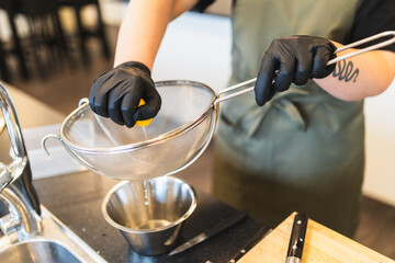 Chef squeezing lemon