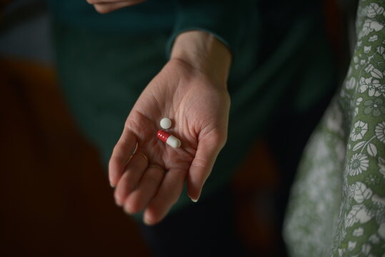Close-Up of Hand Holding Medication Pills