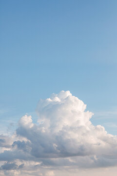 big, puffy white cloud in blue sky