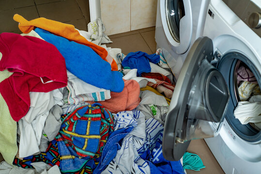 Heap of second hand laundry and washing machines