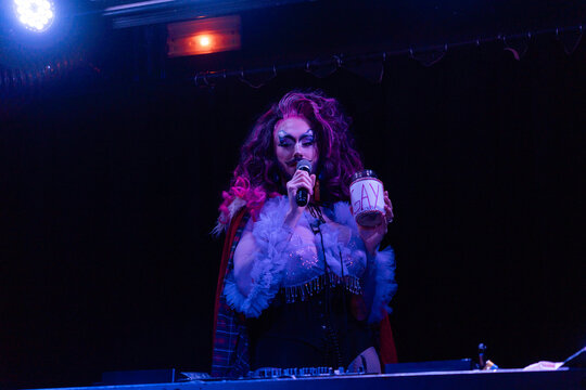 Drag Queen DJ Making Music On Set.