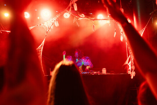 Drag Queen DJ Making Music On Set.