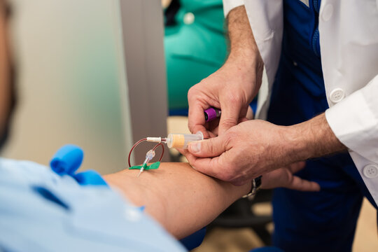 Medical professional administering iv therapy