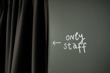 "Only Staff" - Handwritten text on the wall in a Coffee Shop.