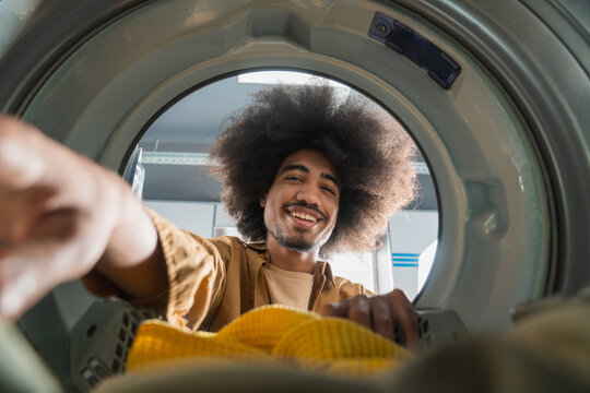 Smiling Man Through Washing Machine