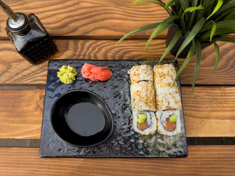 Sushi, ginger, vasabi and soya sauce on a table
