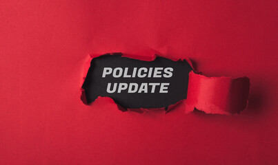 A red background with a black word that says Policies Update